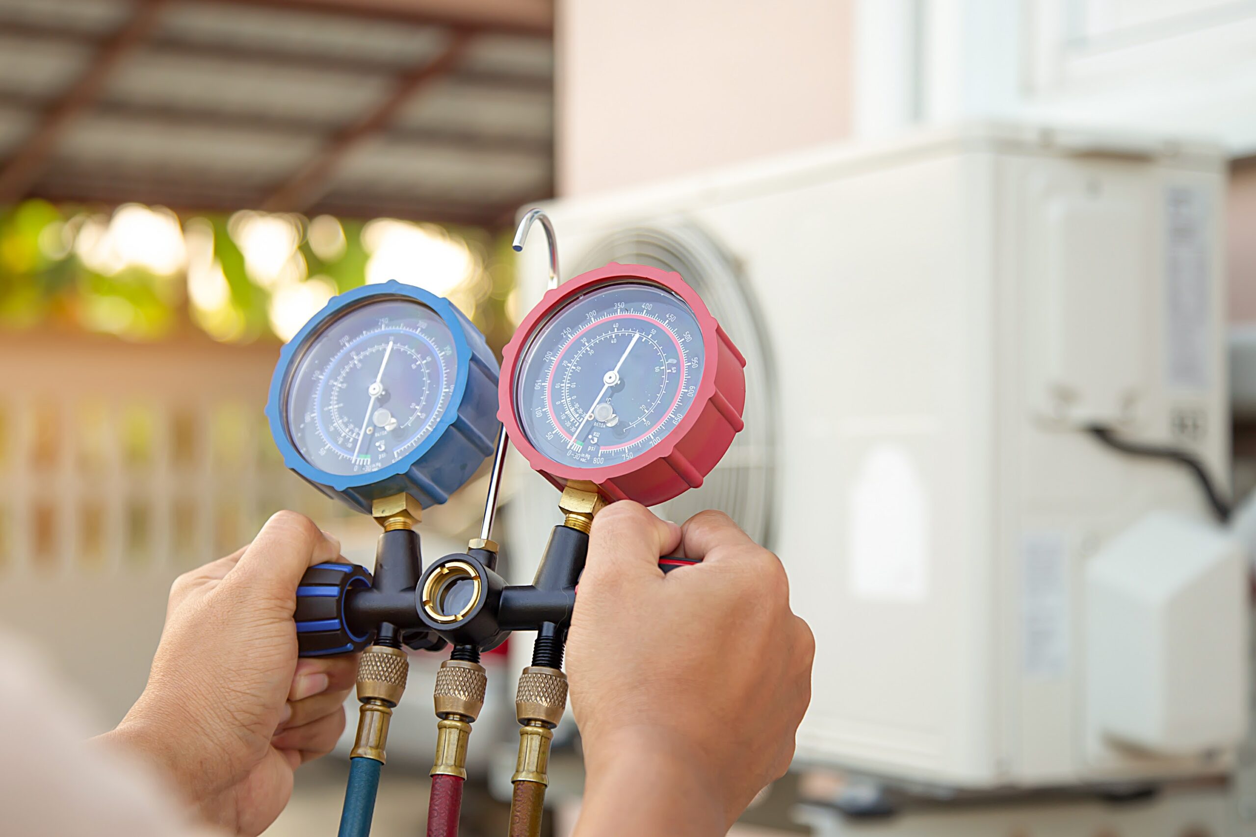 HVAC technician using gauge